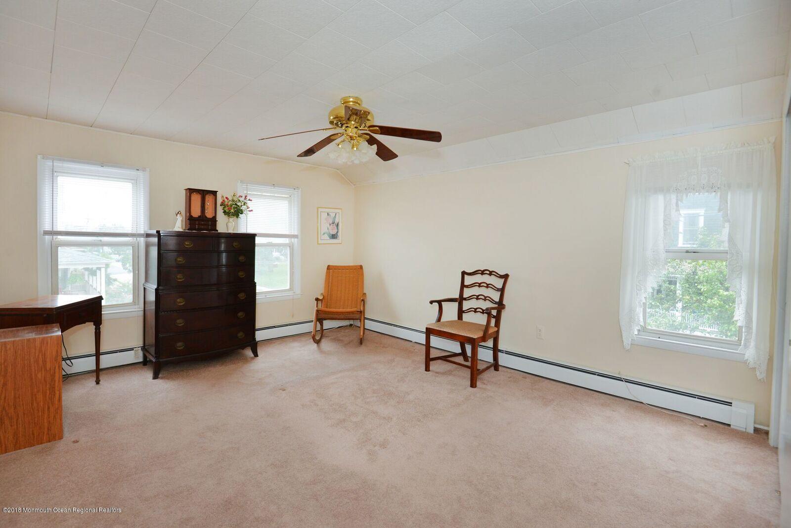 77 Cookman Avenue Ocean Grove, NJ 07756 - Photo 17 of 23 a view of a workspace with furniture and a window
