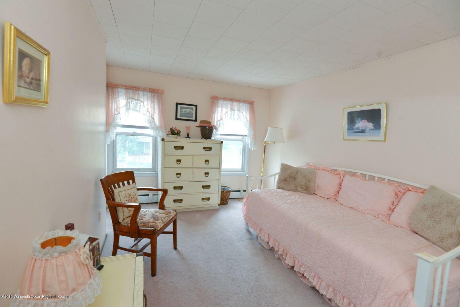 77 Cookman Avenue Ocean Grove, NJ 07756 - Photo 18 of 23 a living room with furniture and a window