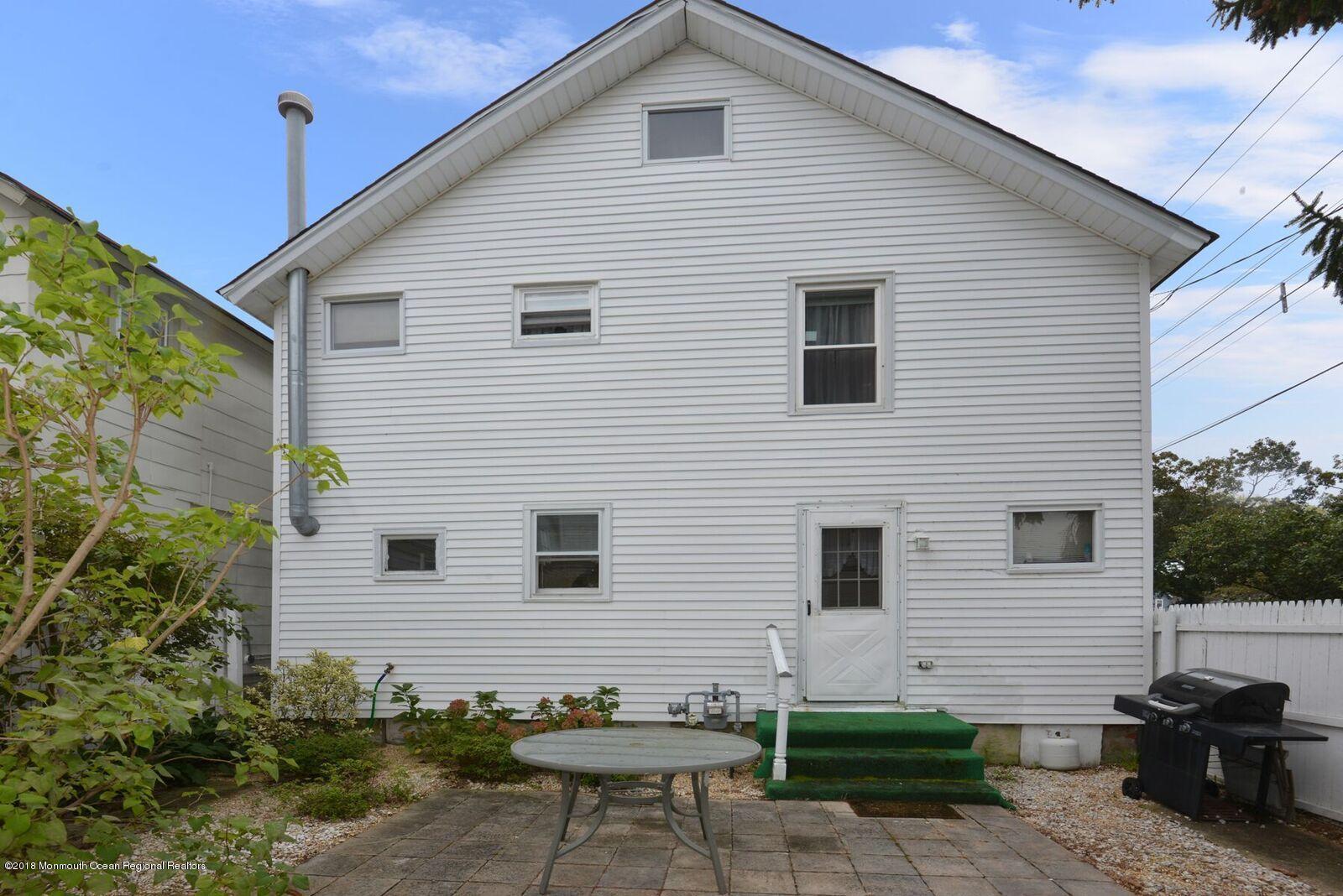 77 Cookman Avenue Ocean Grove, NJ 07756 - Photo 20 of 23 a view of a house with a backyard