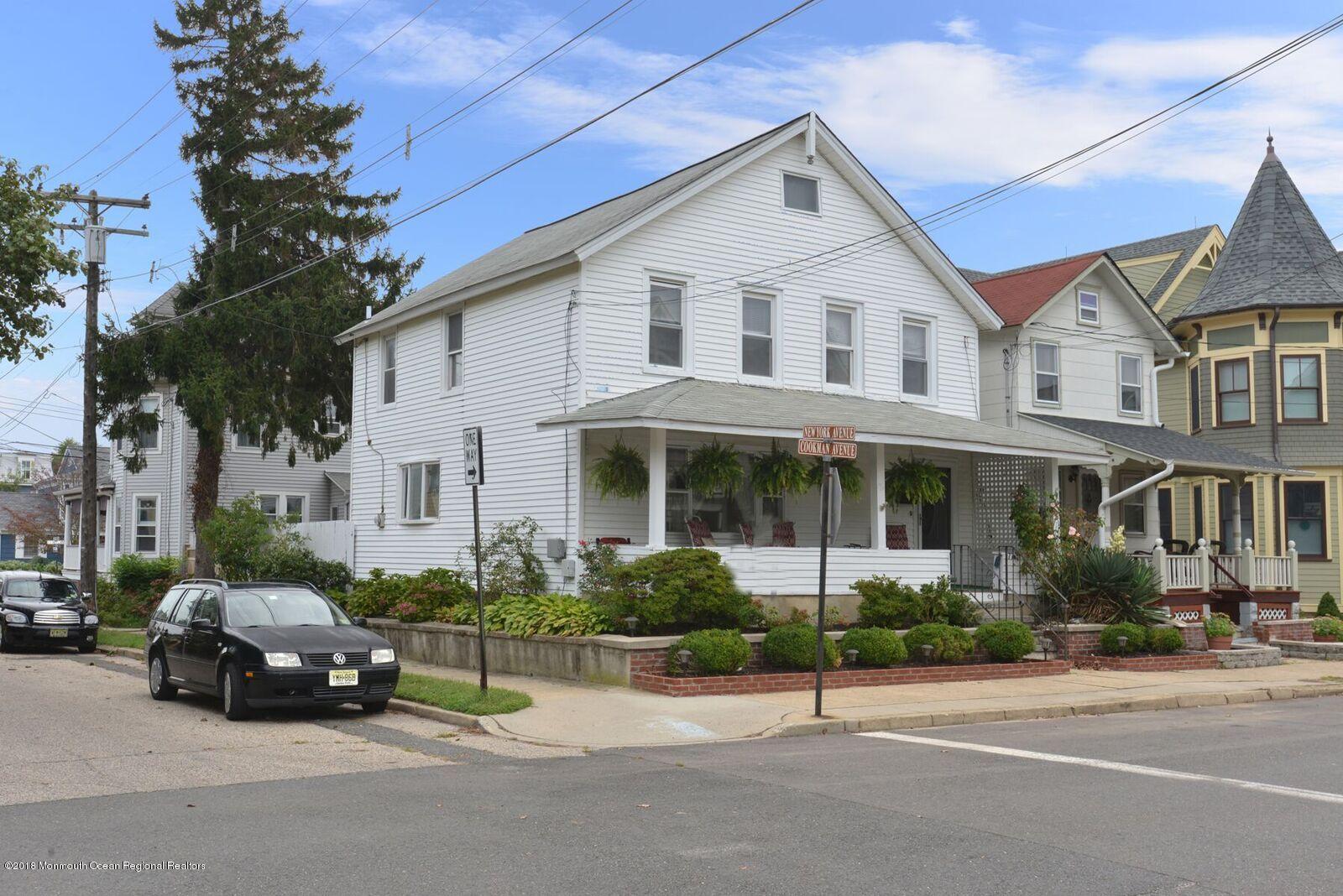 77 Cookman Avenue Ocean Grove, NJ 07756 - Photo 2 of 23 a car parked in front of a white house
