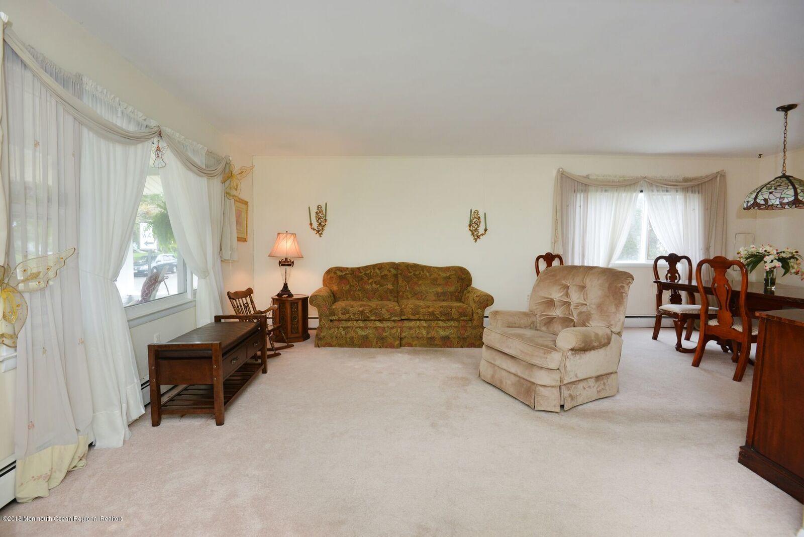 77 Cookman Avenue Ocean Grove, NJ 07756 - Photo 7 of 23 a living room with furniture and a window