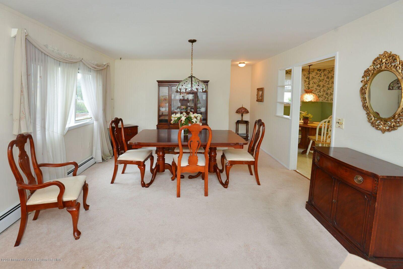 77 Cookman Avenue Ocean Grove, NJ 07756 - Photo 9 of 23 a dining room with furniture and window