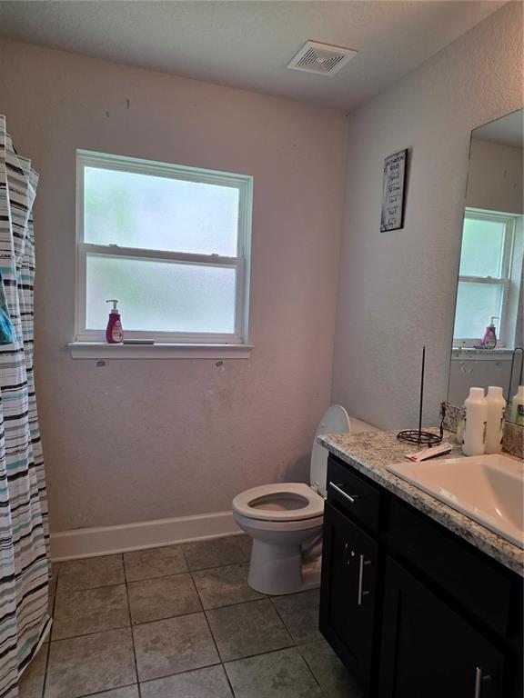9 Cedar Run Ocala, FL 34472 - Photo 14 of 15 a bathroom with a granite countertop sink a toilet and a window