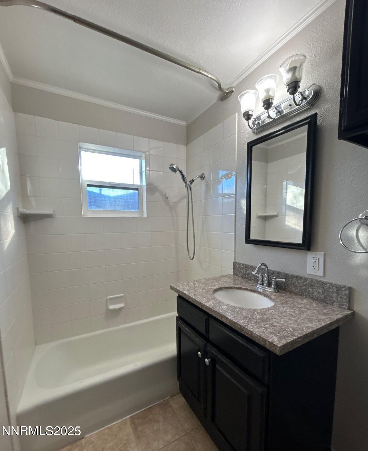 660 Kirman Avenue Reno, NV 89502 - Photo 12 of 17 a bathroom with a granite countertop sink a toilet a mirror and bathtub
