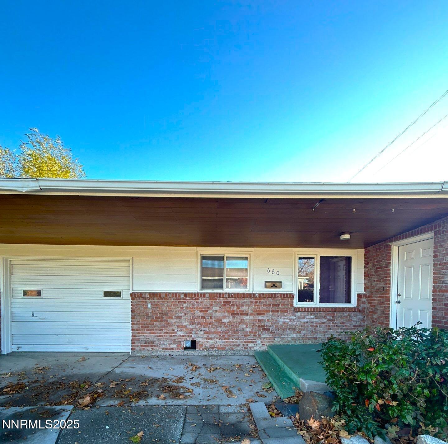 660 Kirman Avenue Reno, NV 89502 - Photo 2 of 17 a front view of a house with a yard