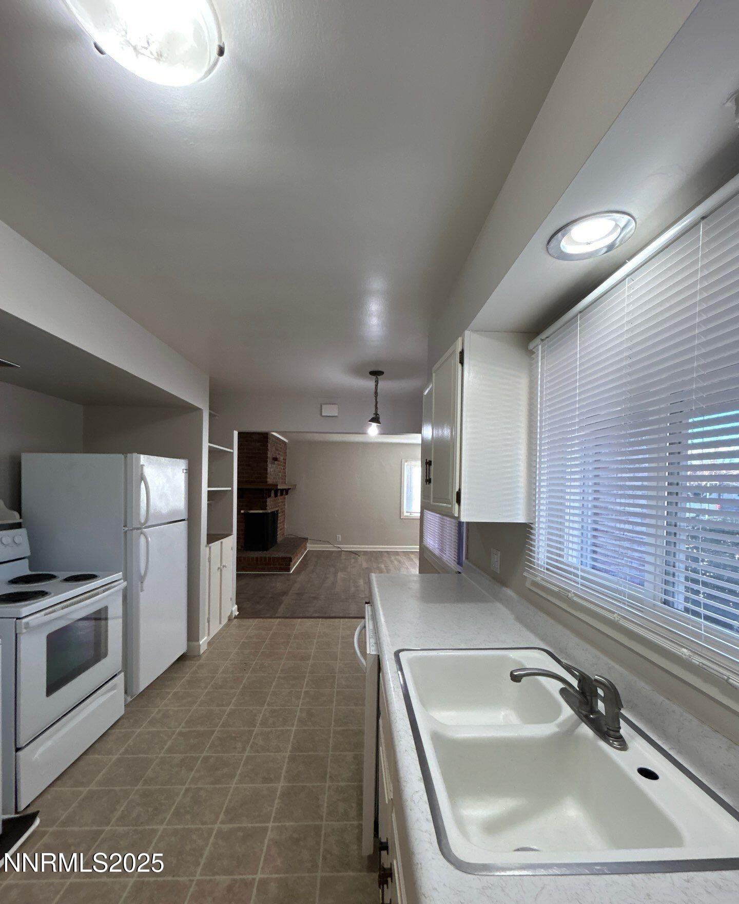 660 Kirman Avenue Reno, NV 89502 - Photo 8 of 17 a bathroom with a sink and a large mirror