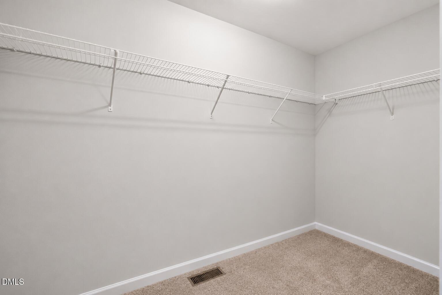 364 Springtime Fields Lane Wake Forest, NC 27587 - Photo 35 of 63 a view of a room with racks on the wall