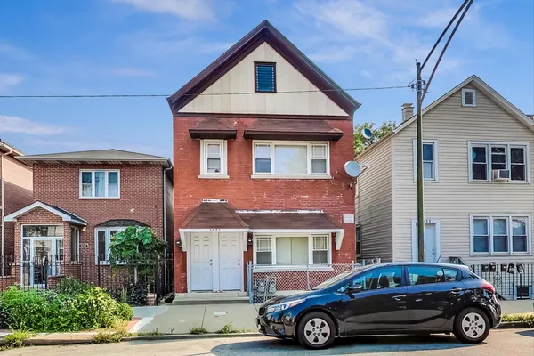 a car parked in front of a house