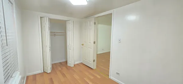 a view of a bathroom with wooden floor