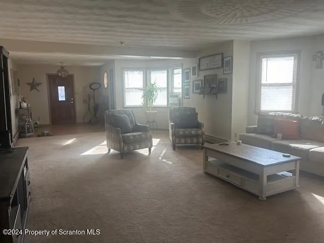 a lobby with furniture and windows