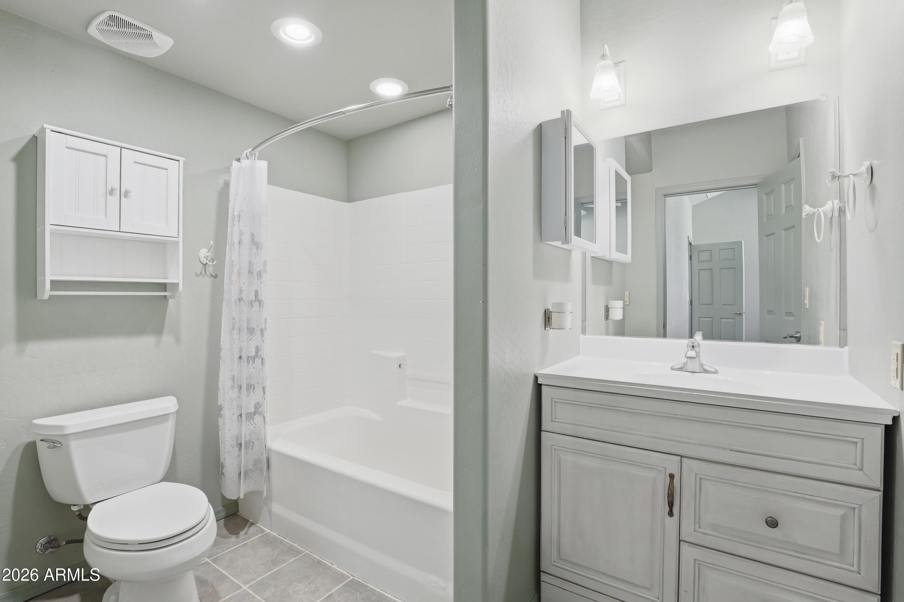 228 Windmill Road Payson, AZ 85541 - Photo 24 of 42 a bathroom with a sink toilet vanity and shower