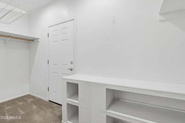 a view of an empty walk in closet