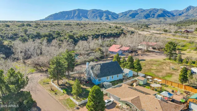 an aerial view of a house with lake view