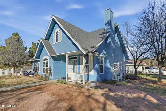 a view of a large house with a street