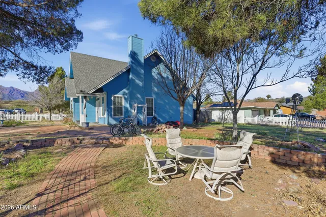 a view of a patio with table and chairs and a fire pit