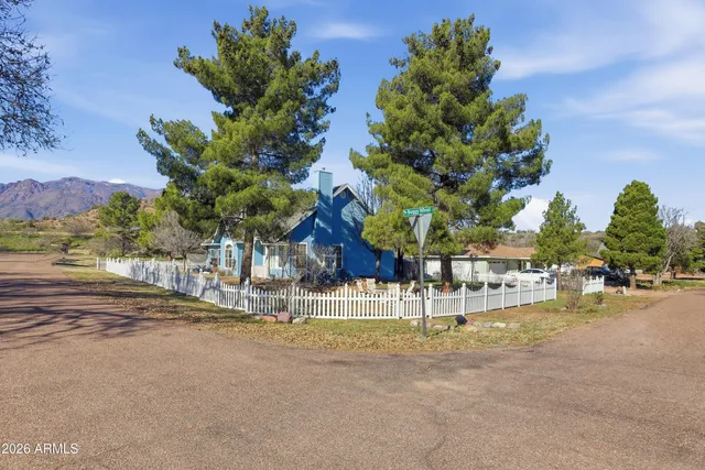 a view of a house with a street