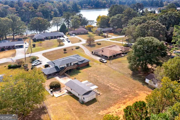 an aerial view of residential houses with outdoor space