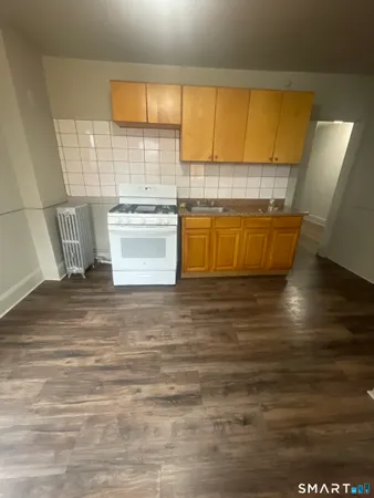 a view of kitchen with wooden floor
