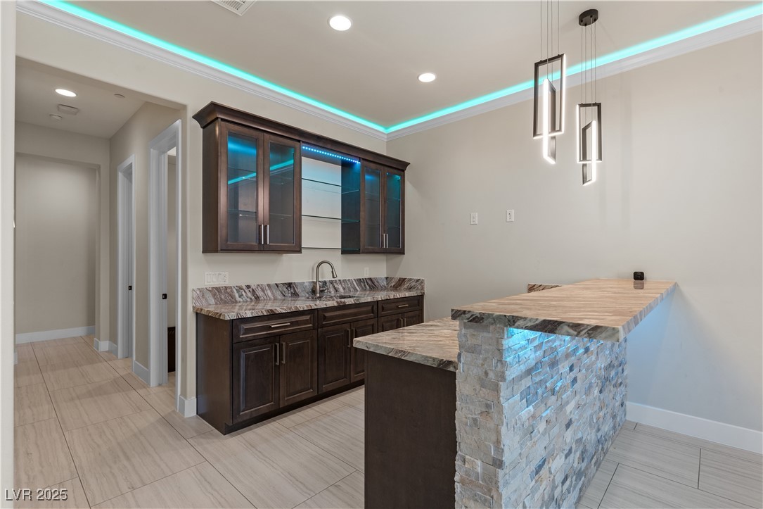 9865 Bright Angel Way Las Vegas, NV 89149 - Photo 36 of 98 Indoor bar with decorative light fixtures, baseboards, and recessed lighting