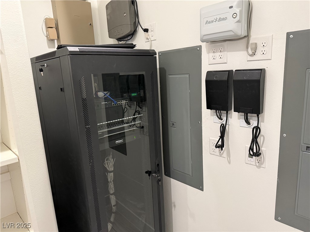 9865 Bright Angel Way Las Vegas, NV 89149 - Photo 38 of 98 AV Room, Irrigation Clock, Landscape Transformers, Permanent Lights, Eave Light Timers, Alarm Module