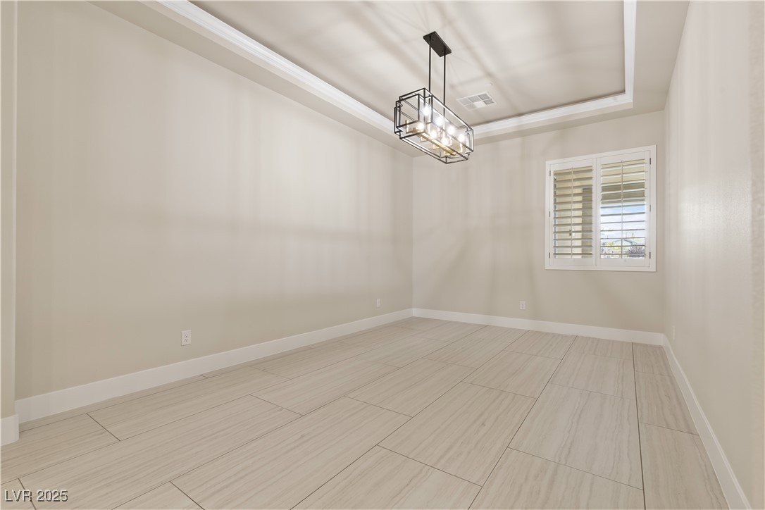 9865 Bright Angel Way Las Vegas, NV 89149 - Photo 44 of 98 Dining room with baseboards and a chandelier