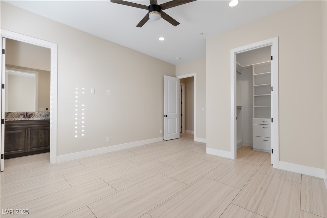 9865 Bright Angel Way Las Vegas, NV 89149 - Photo 61 of 98 Bathroom #3 En suite featuring baseboards, a shower stall, vanity, toilet, and recessed lighting