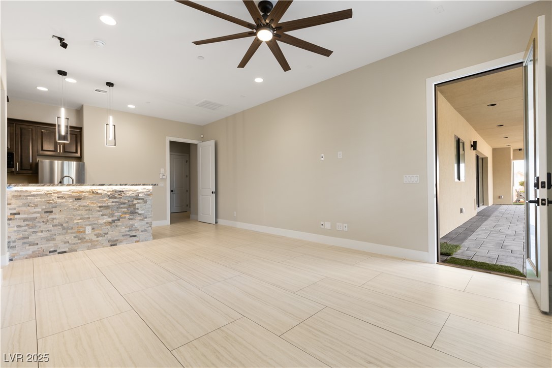9865 Bright Angel Way Las Vegas, NV 89149 - Photo 64 of 98 Casita #1 living room featuring a ceiling fan, recessed lighting, and baseboards.