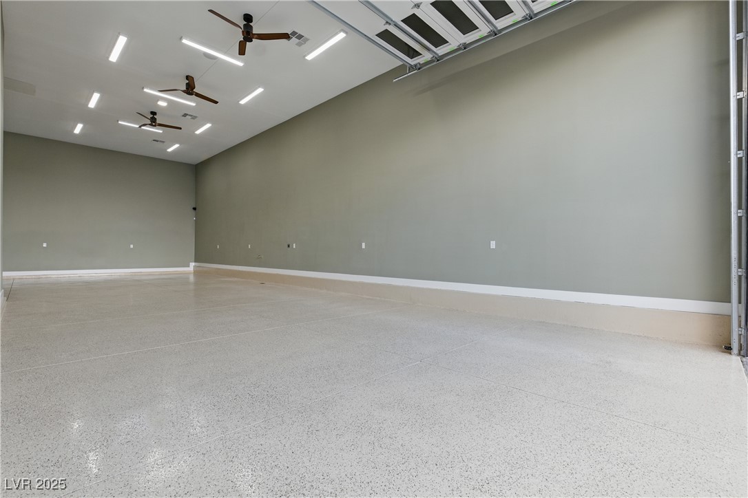 9865 Bright Angel Way Las Vegas, NV 89149 - Photo 87 of 98 1527 sq ft RV Garage, Spray Foam Walls and Lid, HVAC Thermostatically Controlled, Sewer, Cleanout, 50 Amp 220V EV Outlet, Surveillance, Alarm, Wash Sink, Epoxy Floors, Base Molding, LED Lighting Package, 5 Ceiling Fans, 16' X 14' Steel Back Insulated Garage Door, Wall Mount Torsion Opener