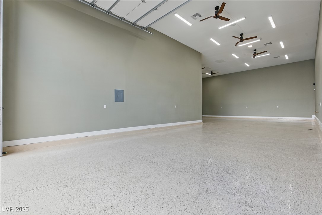 9865 Bright Angel Way Las Vegas, NV 89149 - Photo 89 of 98 1527 sq ft RV Garage, Spray Foam Walls and Lid, HVAC Thermostatically Controlled, Sewer, Cleanout, 50 Amp 220V EV Outlet, Surveillance, Alarm, Wash Sink, Epoxy Floors, Base Molding, LED Lighting Package, 5 Ceiling Fans, 16' X 14' Steel Back Insulated Garage Door, Wall Mount Torsion Opener