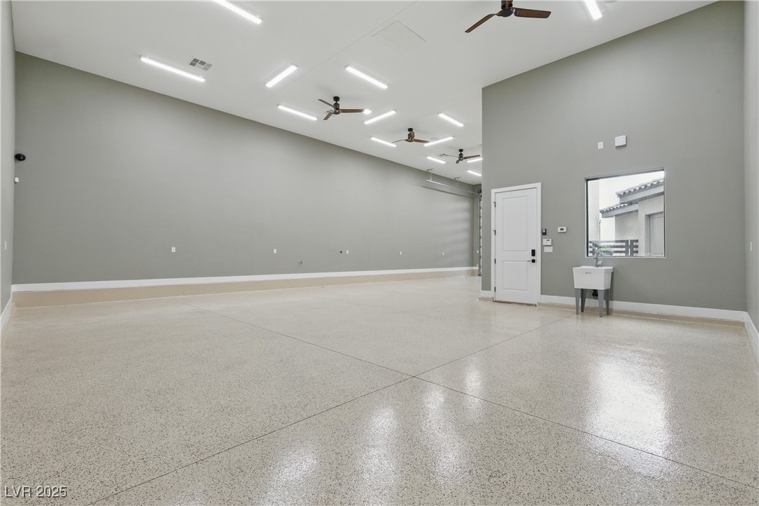 9865 Bright Angel Way Las Vegas, NV 89149 - Photo 92 of 98 1527 sq ft RV Garage, Spray Foam Walls and Lid, HVAC Thermostatically Controlled, Sewer, Cleanout, 50 Amp 220V EV Outlet, Surveillance, Alarm, Wash Sink, Epoxy Floors, Base Molding, LED Lighting Package, 5 Ceiling Fans, 16' X 14' Steel Back Insulated Garage Door, Wall Mount Torsion Opener