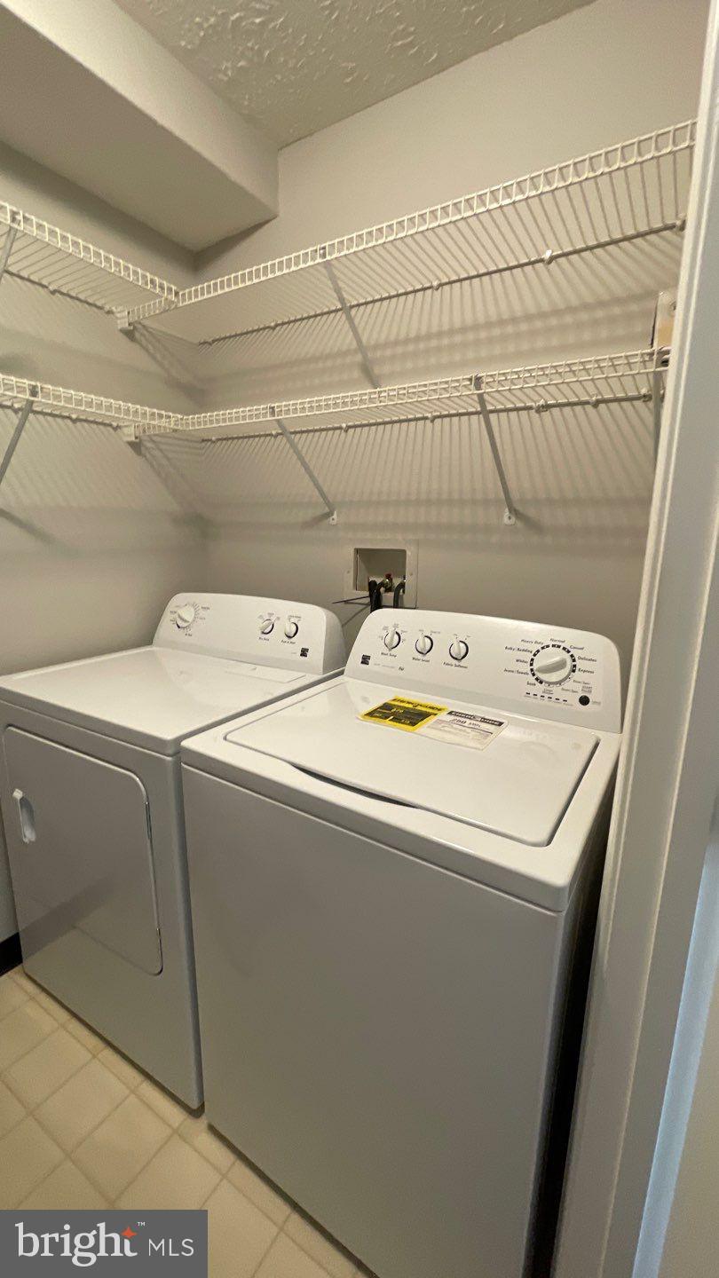 4915 Riders Court, Unit 4915 Owings Mills, MD 21117 - Photo 15 of 25 a utility room with dryer and washer