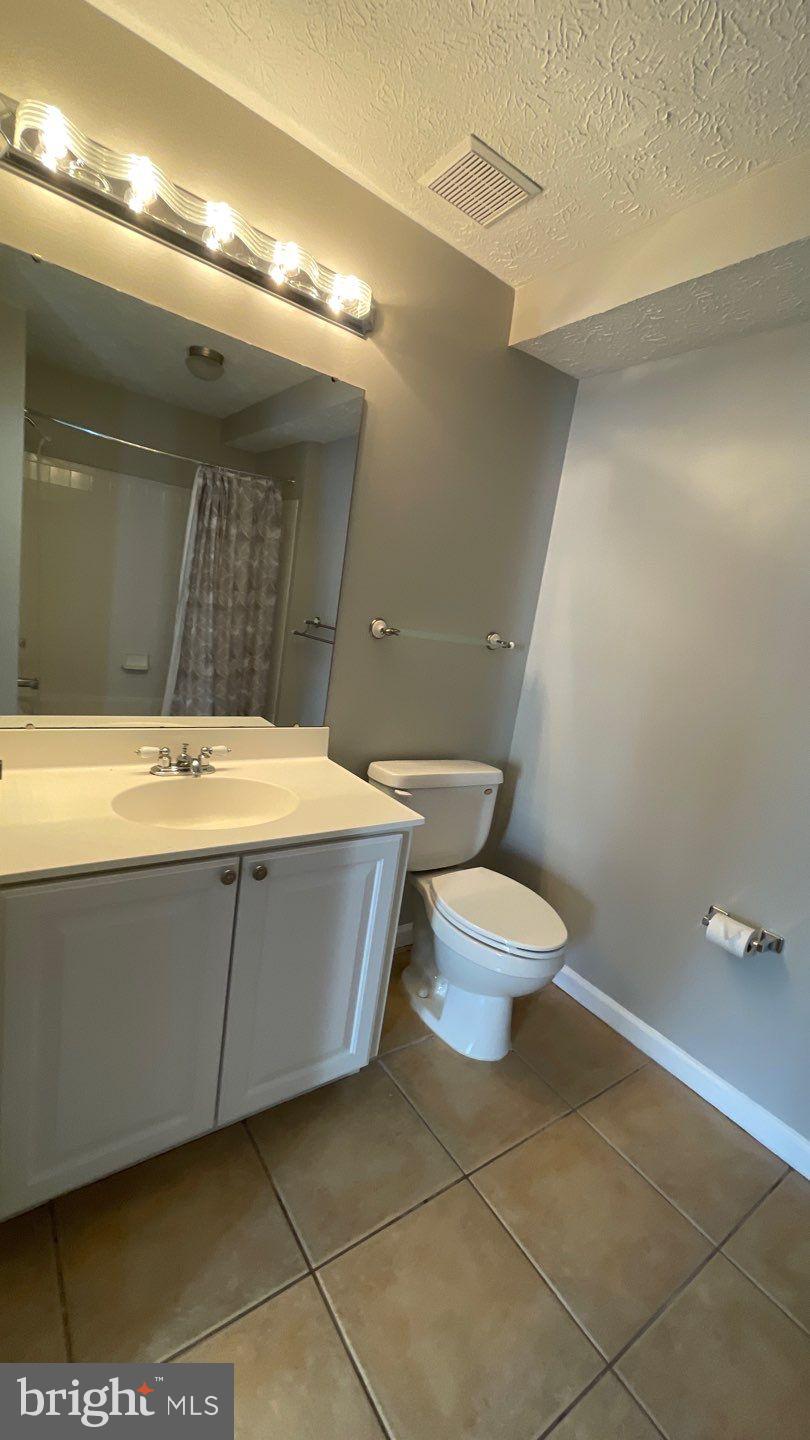4915 Riders Court, Unit 4915 Owings Mills, MD 21117 - Photo 18 of 25 a bathroom with a toilet