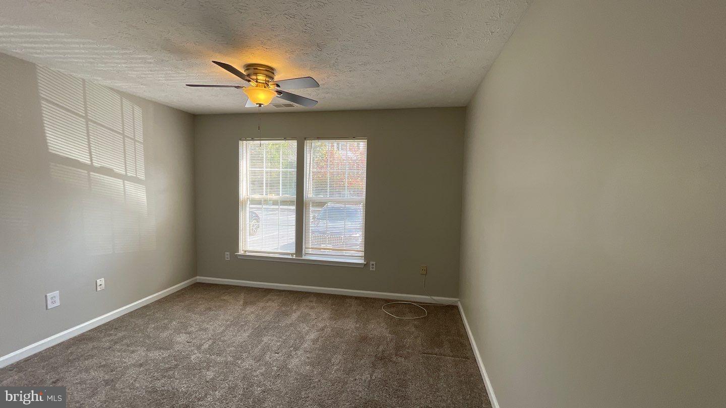4915 Riders Court, Unit 4915 Owings Mills, MD 21117 - Photo 21 of 25 a view of an empty room with a window