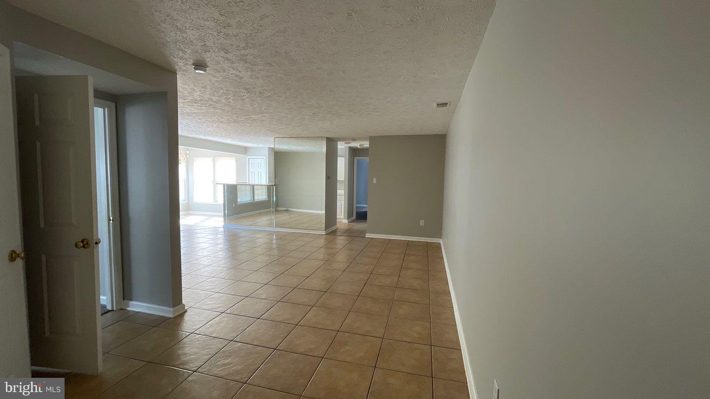 4915 Riders Court, Unit 4915 Owings Mills, MD 21117 - Photo 4 of 25 a view of a hallway
