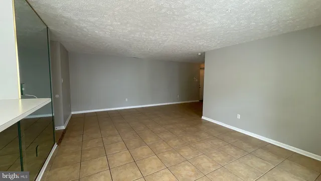 an empty room with a bench