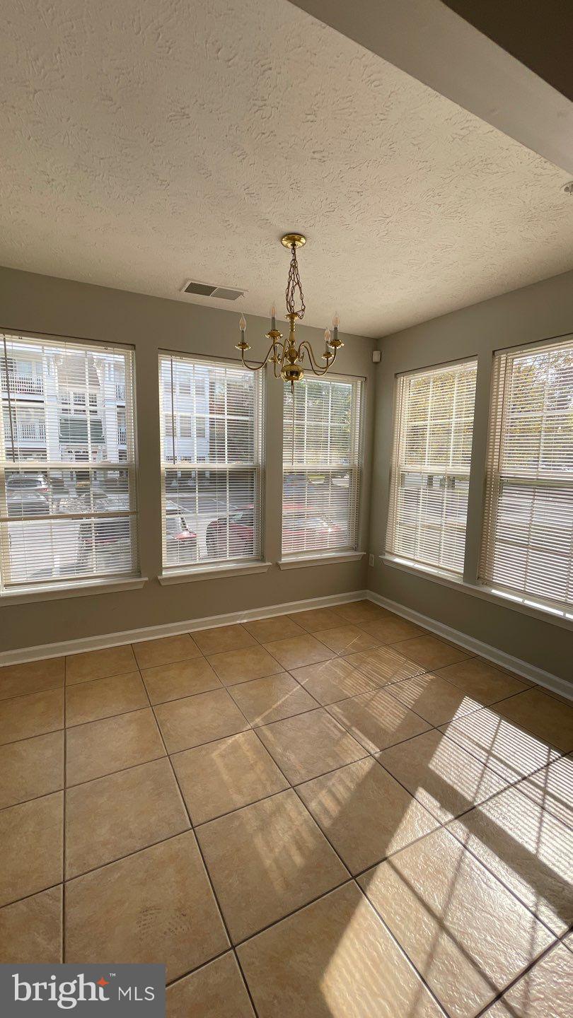 4915 Riders Court, Unit 4915 Owings Mills, MD 21117 - Photo 8 of 25 a view of an empty room with a window