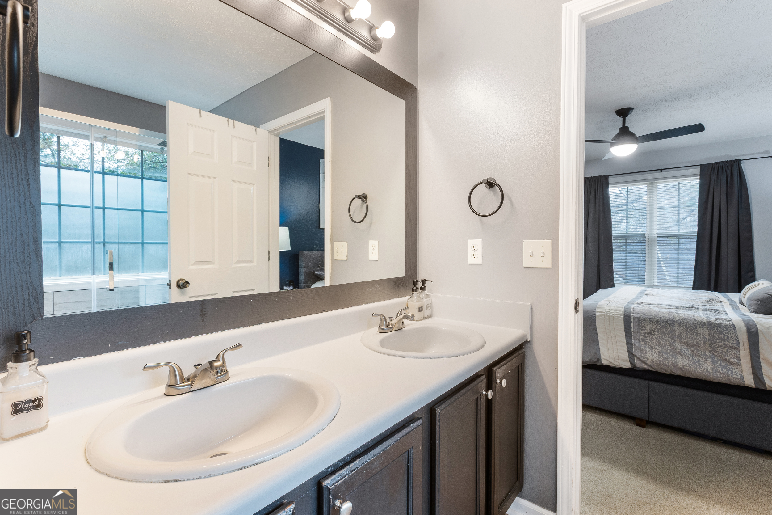 159 Villa Rosa Ridge Temple, GA 30179 - Photo 16 of 31 a bathroom with a double vanity sink and a mirror