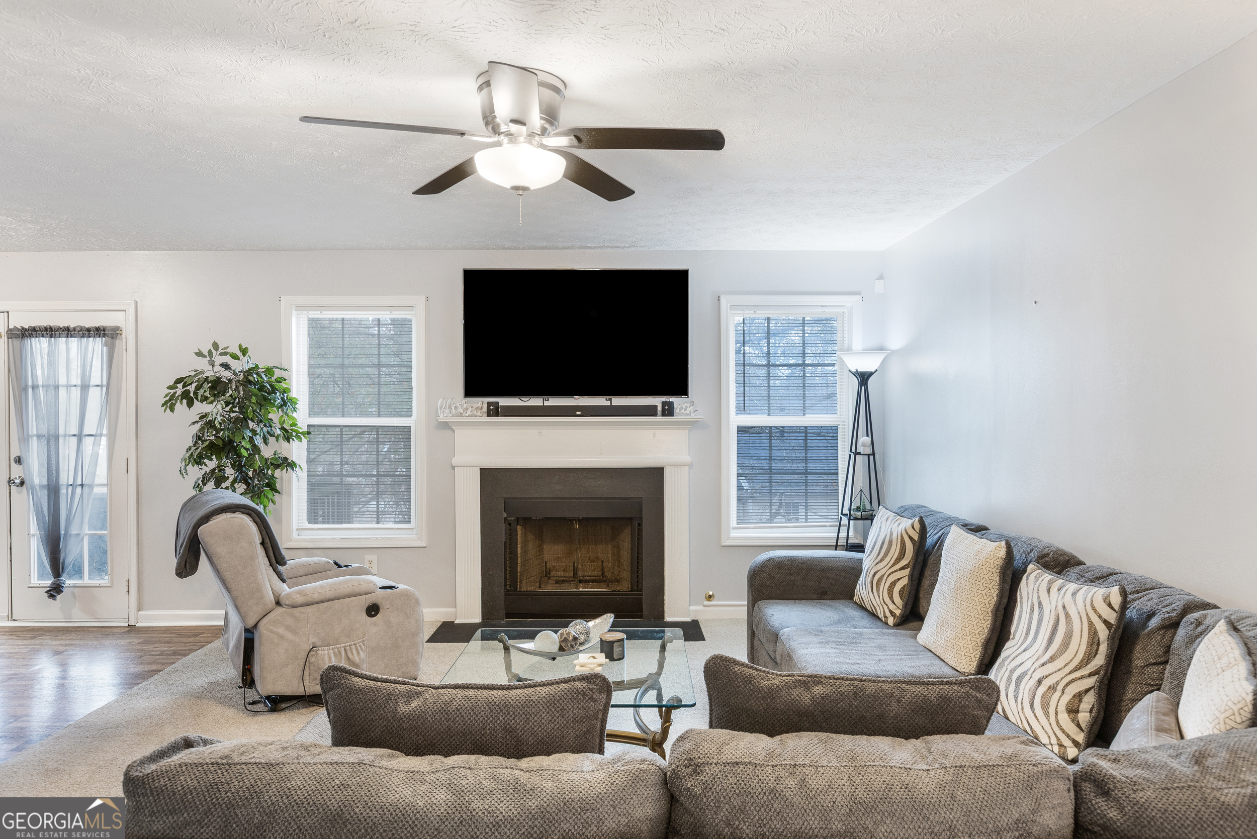 159 Villa Rosa Ridge Temple, GA 30179 - Photo 3 of 31 a living room with furniture a fireplace and a flat screen tv