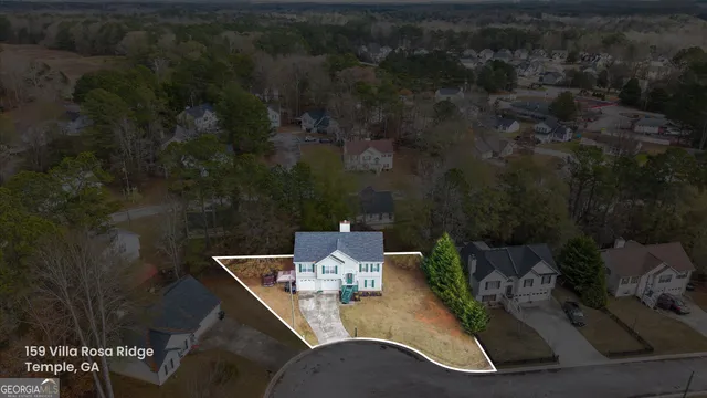 a view of a couches and a table in the balcony