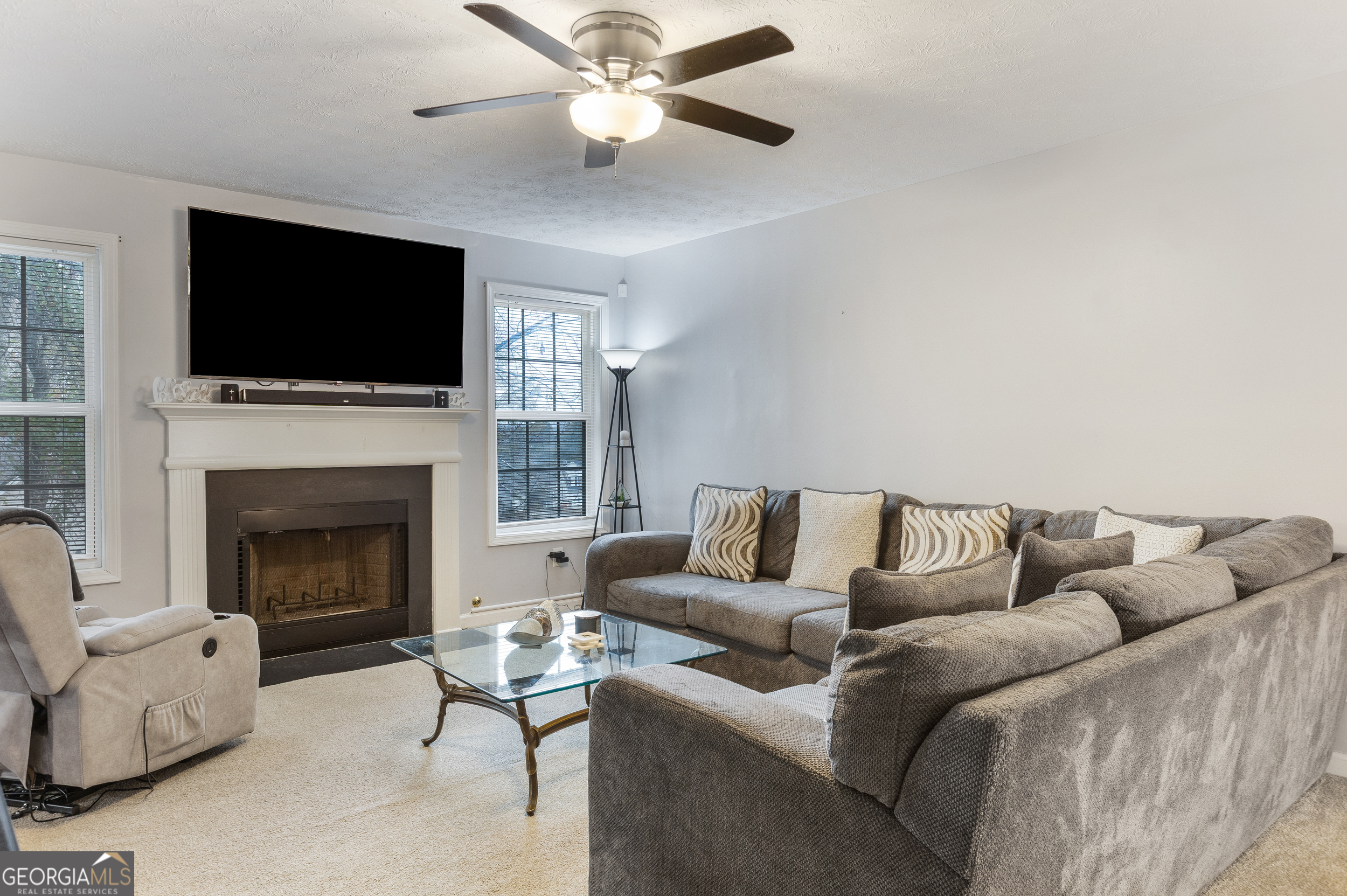 159 Villa Rosa Ridge Temple, GA 30179 - Photo 5 of 31 a living room with furniture fireplace and flat screen tv