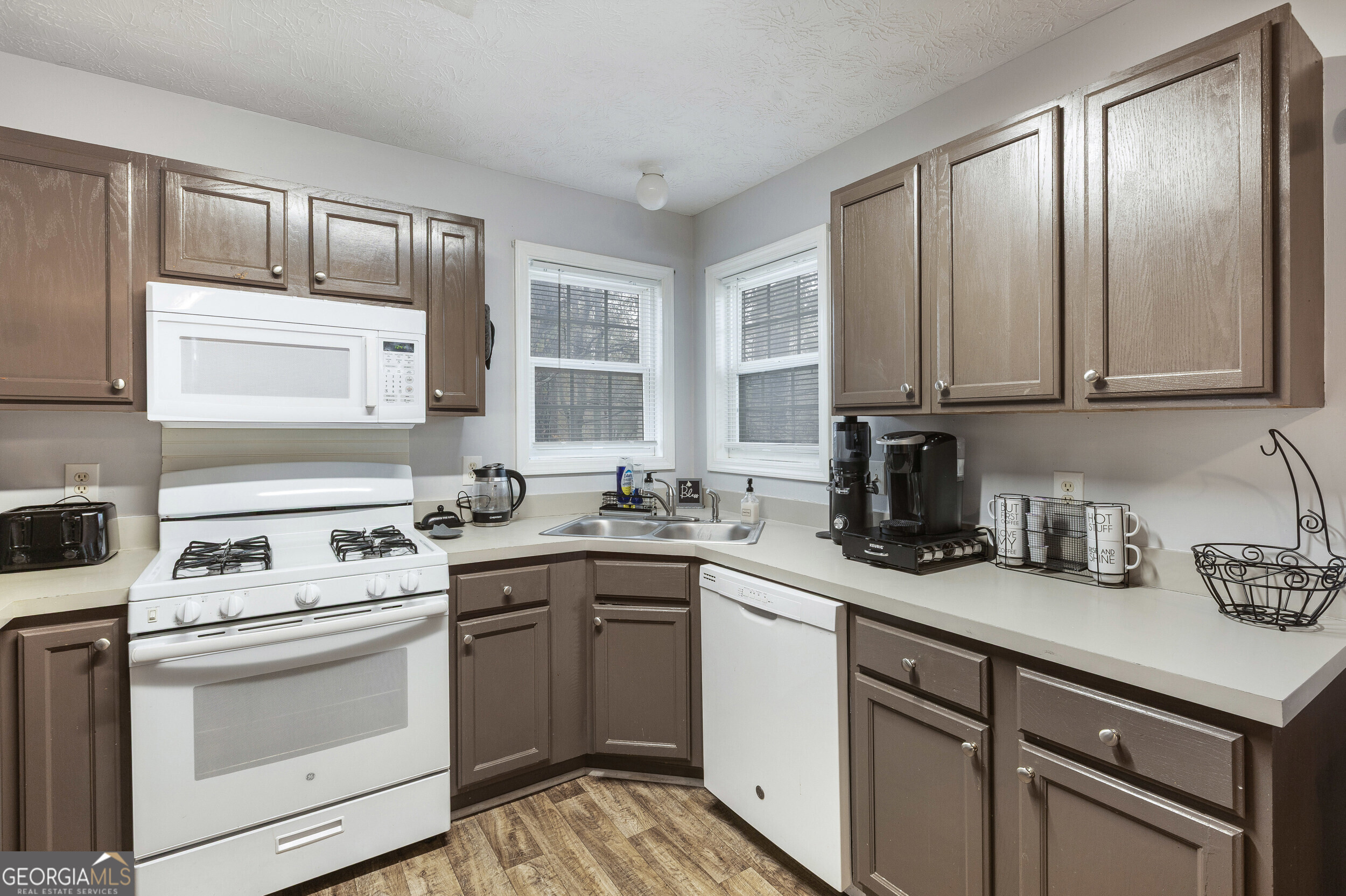 159 Villa Rosa Ridge Temple, GA 30179 - Photo 8 of 31 a kitchen with cabinets appliances a sink and a window