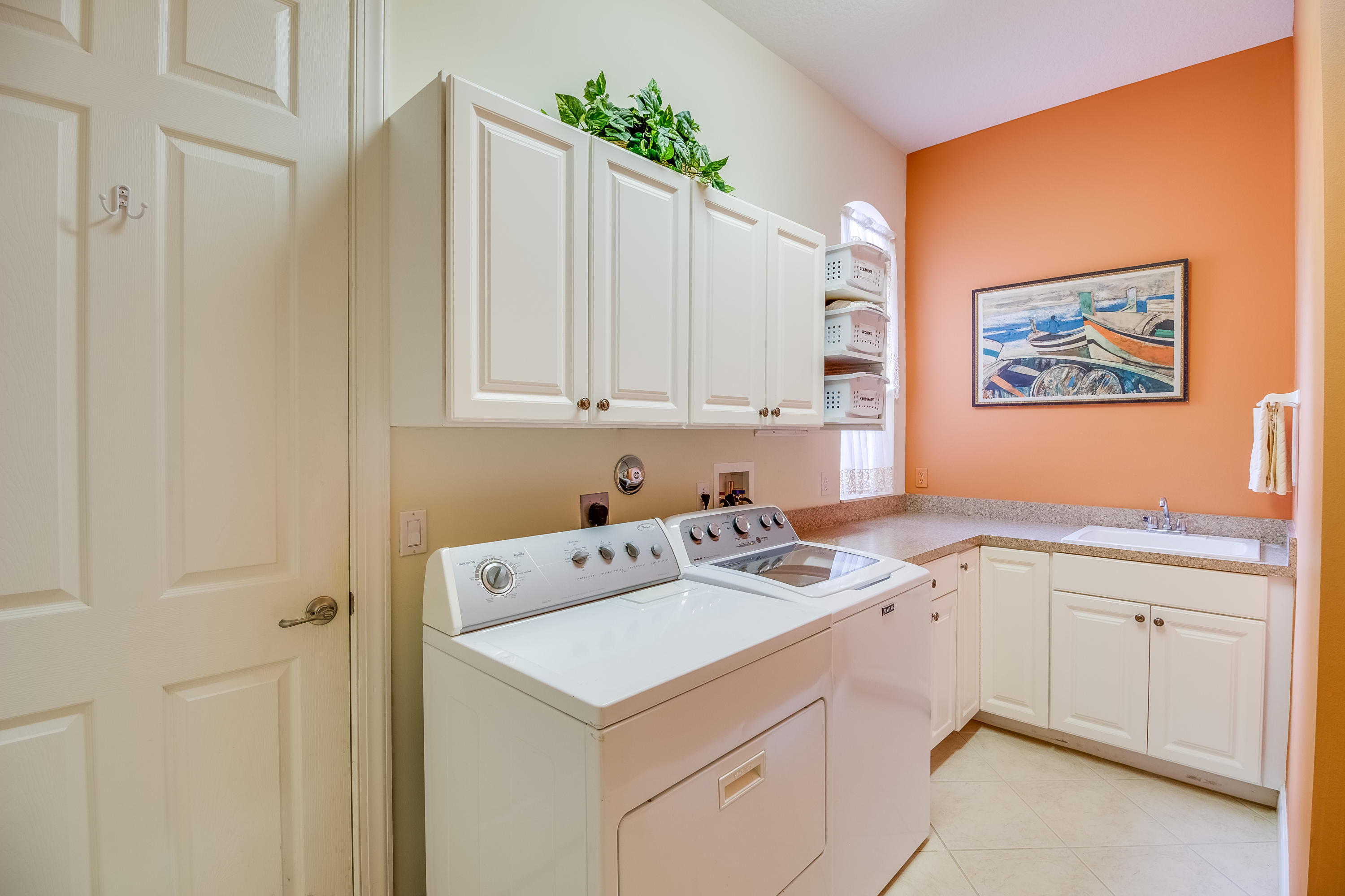 8617 Tompson Point Road Port St. Lucie, FL 34986 - Photo 30 of 38 a view of cabinets with sink