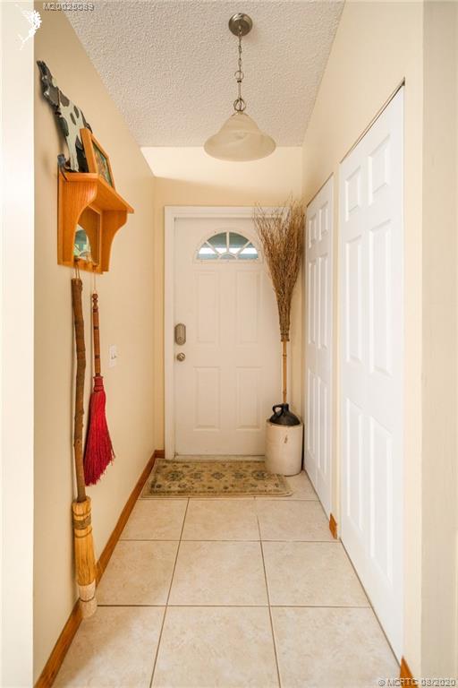 4063 Southeast Jacaranda Street Stuart, FL 34997 - Photo 11 of 34 a view of a hallway with windows