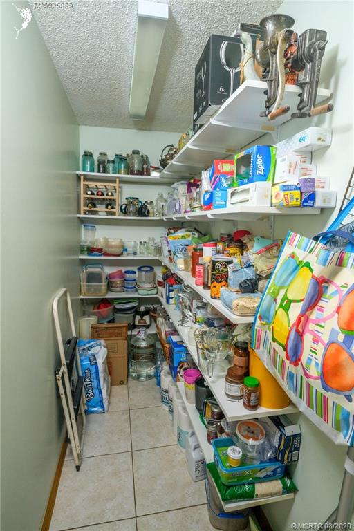 4063 Southeast Jacaranda Street Stuart, FL 34997 - Photo 13 of 34 a room with storage and utility