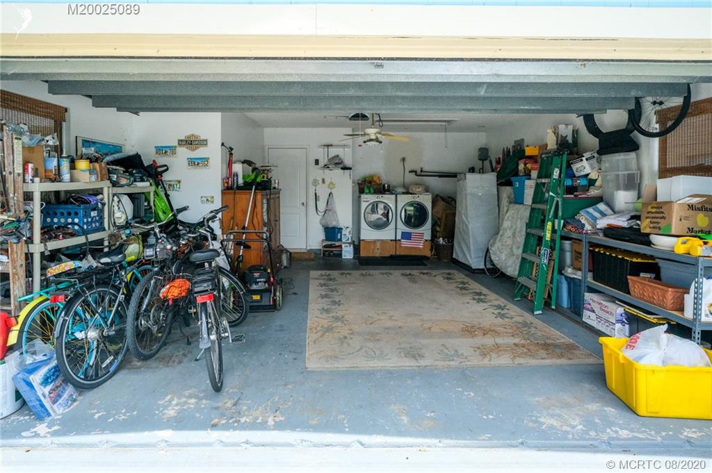 4063 Southeast Jacaranda Street Stuart, FL 34997 - Photo 19 of 34 a view of a room with gym equipment
