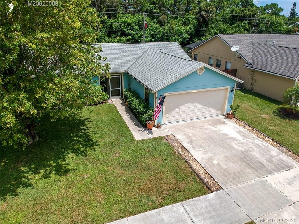 4063 Southeast Jacaranda Street Stuart, FL 34997 - Photo 33 of 34 an aerial view of a house