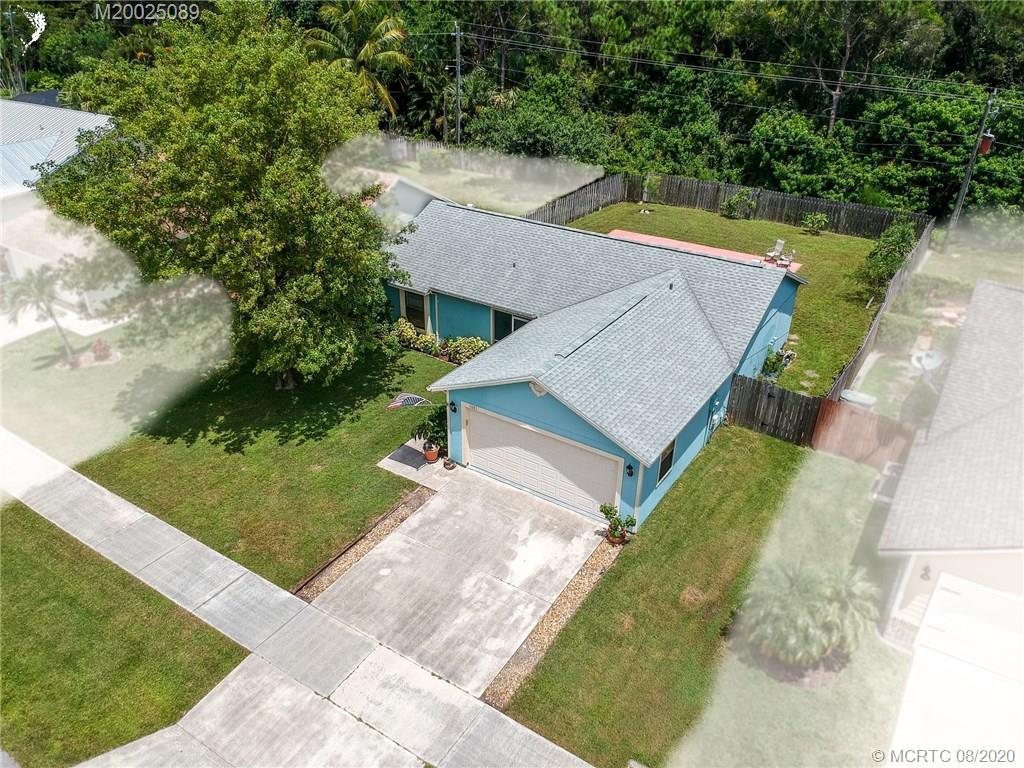 4063 Southeast Jacaranda Street Stuart, FL 34997 - Photo 34 of 34 an aerial view of a house