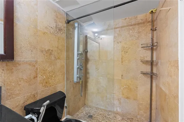a bathroom with a shower and a sink
