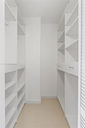 a view of an empty walk in closet