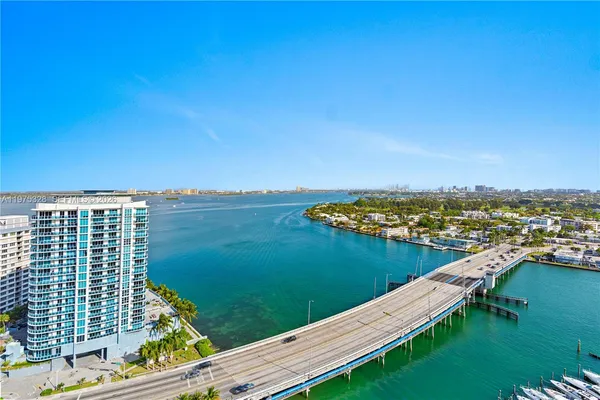 a view of a lake with tall buildings